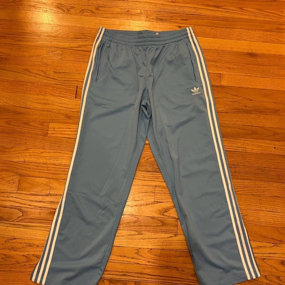 Adidas light blue track pants with white stripes - Size Large